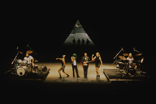 Mike Kelley, Anita Pace, Stephen Prina. Beat of the Traps. 1992. Performed in Expanded Art, Wiener Festwochen, The Remise, Vienna, Austria, 1992. Performers (from left): Jonathan “Butch” Norton, Carl Burkley, Alan Abelew, Stephen Prina, Anita Pace, M.B. Gordy. Photo: Karl Krauss. © 2025 Mike Kelley Foundation for the Arts. All Rights Reserved/Licensed by VAGA at Artists Rights Society (ARS), NY, Anita Pace, Stephen Prina