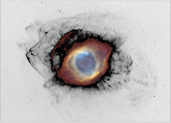 The Helix Nebula and the cosmic recycling of stellar material. The bright central nebula surrounds a white dwarf, the remnant of the star that created it. Farther out, newly revealed bow shocks show fragments of material cast off by that star colliding with surrounding interstellar gas. The fragments become progressively smaller and more disrupted as they are stripped, shredded and mixed into space. The new MOTHRA data is shown in black, with previous data from the Hubble Space Telescope and the Kitt Peak 4m telescope in color. Credit for the previous data: NASA, ESA, C. R. O’Dell (Vanderbilt University) and M. Meixner, P. McCullough and G. Bacon (Space Telescope Science Institute).