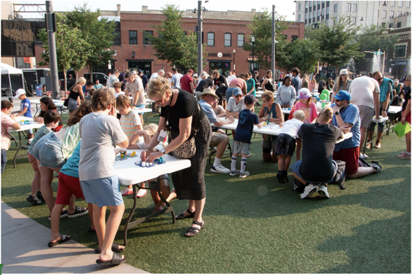 Attendees fill Broadway Square for the tic-tac-toe world record attempt on July 29.