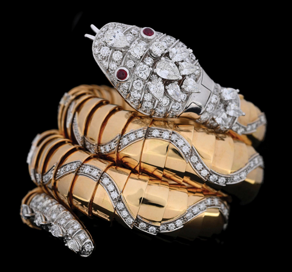 Rare and important Bvlgari Serpenti Jaeger-LeCoultre flexible three-coil diamond and ruby bangle bracelet in 18K yellow and white gold, with the original Bvlgari box. Estimate: $150,000-$250,000