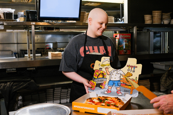 Pediatric Cancer Warrior Maggie with the National Pediatric Cancer Foundation Pizza for Good Pizza Box